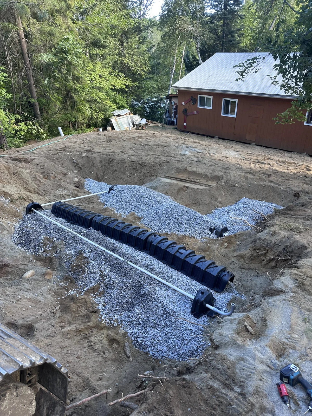 A septic system installation beside a Northern Ontario home